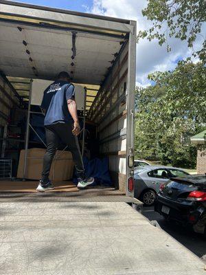 This was the actual photo, as the door was just opened, of the 'full truck' packed end to end they said and I was charged for.  Liars