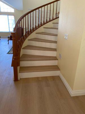 Staircase with with risers done with laminate flooring from Lions Floor Village Park.