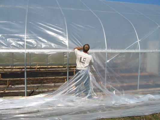 Nic working on a new hoophouse