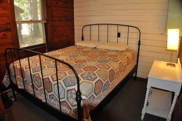 Cottage 8, 9, 10 - knotty pine bedroom with queen bed