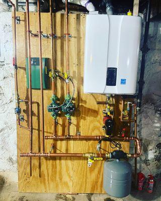 Residential tankless condensing boiler.