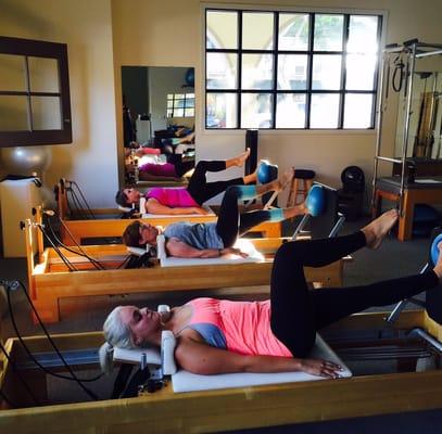 Group jump-board class on the Reformer.