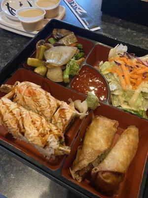 Sushi bento box with Thai roll, Egg Roll, and Hibachi Vegetables