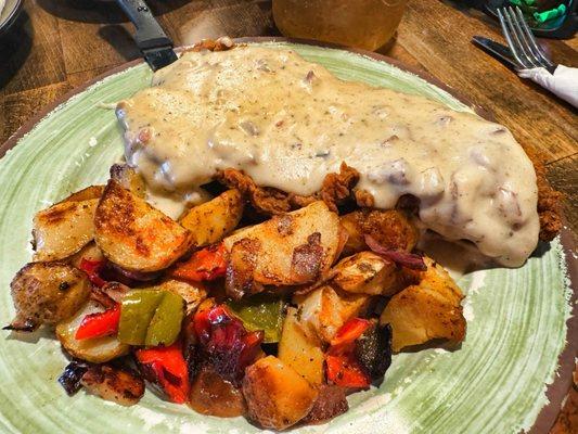 Chicken fried steak and country potatoes