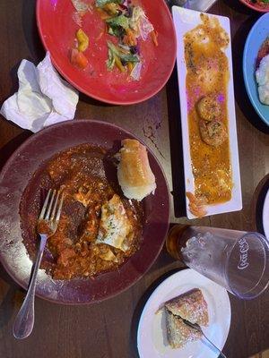 Meat lasagna,salad,shrimp scampi, and baklava.