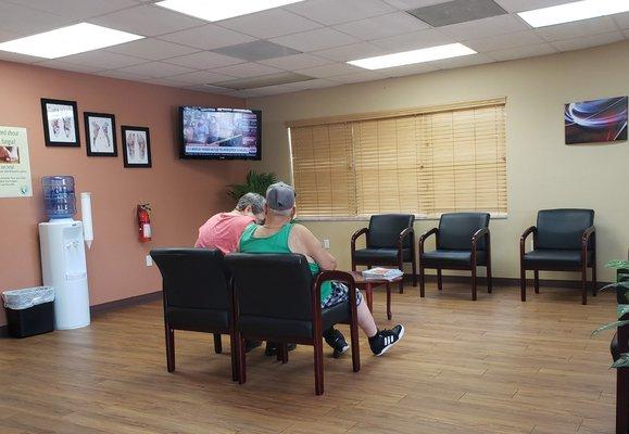 Super clean waiting room with standard decor.