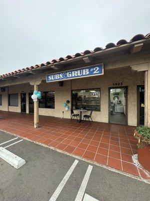 The front area of the restaurant features one table with two chairs.