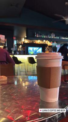 View of my latte and the bar behind it.