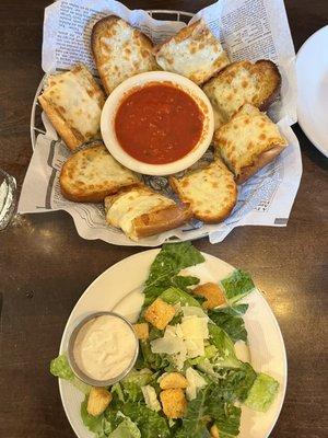 Small Caesar salad and cheesy garlic bread