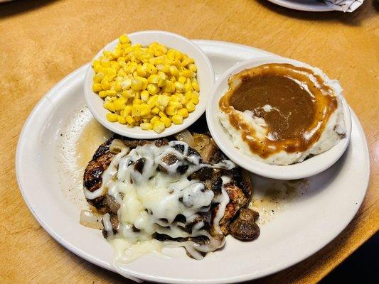 Smothered chicken with Jack cheese, buttered corn and mashed potatoes