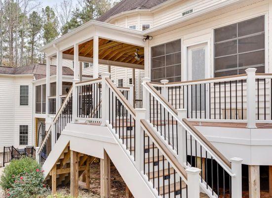 Composite deck with stairs, lighting and railings.