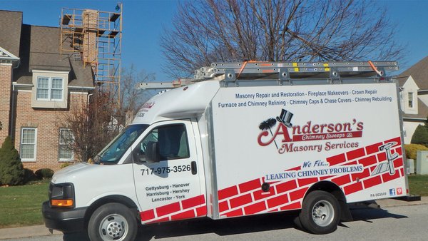 Our masonry crew set up to rebuild a chimney.