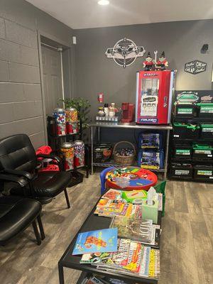 Clean, Family-Friendly waiting room. Hot cocoa, coffee, water, popcorn, Lego table, kids tools, books, magazine & baby shark tank!