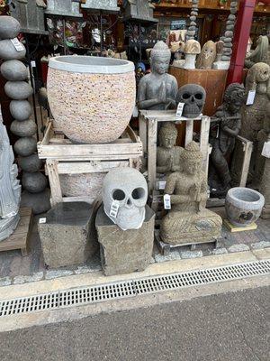 Interesting collection of yard decorations and pots