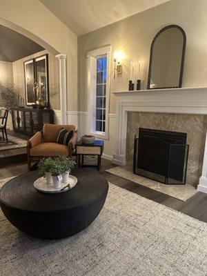 Living room design with a leather accent chair and stunning black coffee table