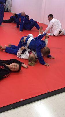 Kids having a great time learning jiu jitsu!