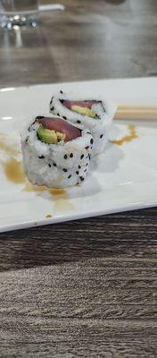 Tuna avocado roll. Half eaten.