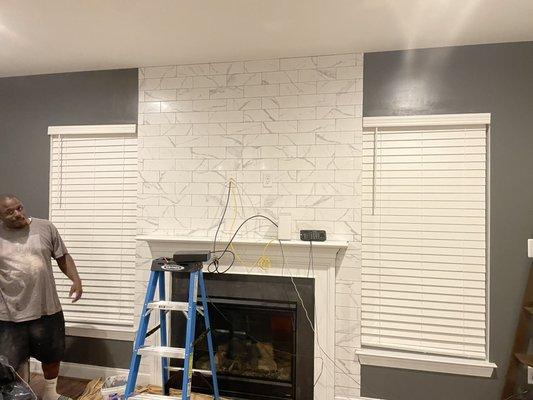 Ceramic tiles around fireplace.