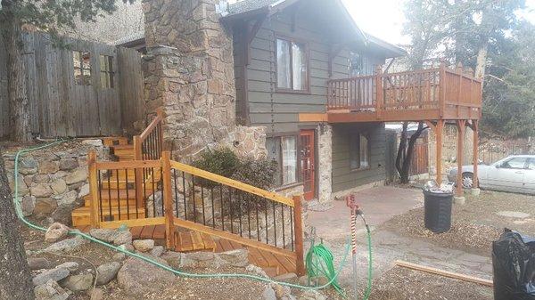 Redwood stairway and handrail with metal balusters, low volt lighting system and cabots stain