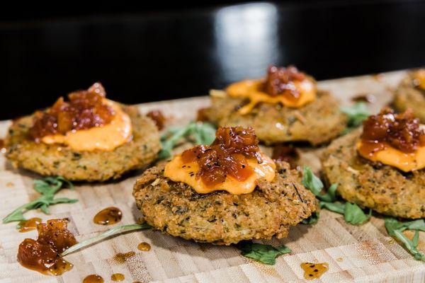 Fried Green Tomatoes appetizer with house-made pimento cheese and sweet tomato jam.