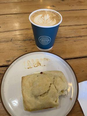 Breakfast biscuit sandwich and peaches cream latte.