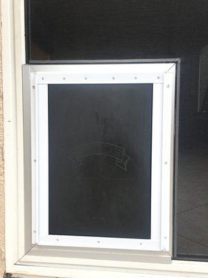 Pet door on slider with pet mesh.