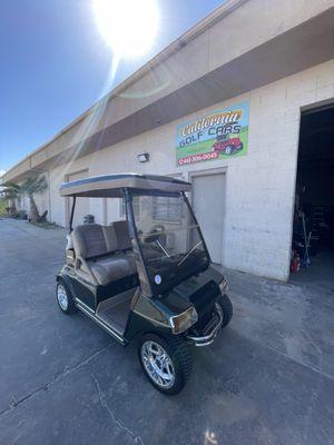 Green classic golf cart