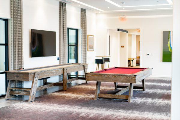 Gaming area with pool, shuffle board, and dedicated poker room.