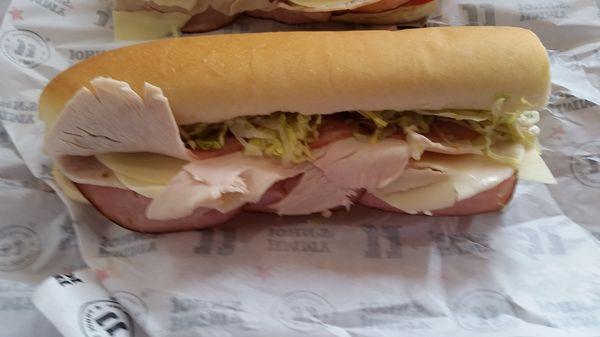 Turkey, ham and cheese. Fresh ingredients. Good soft bread.