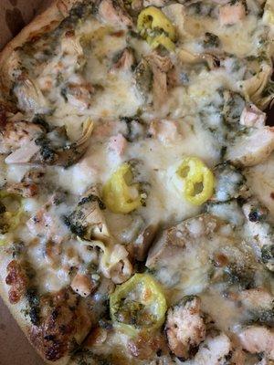 Capital pizza with chicken, pesto, artichoke. We added banana peppers