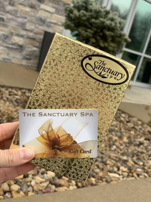 Outside the spa ambiance with the gift card we received for some lovely services