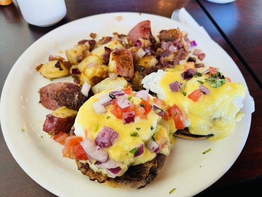 Chorizo, eggs Benedict even better with a little green chili so yummy