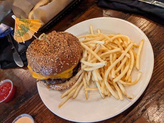 Tiki burger with a side of shoestring fries.