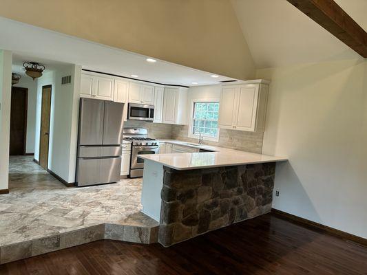 Kitchen, renovation and chimney build out with stone with the knee wall with stone over there in Magnolia Delaware