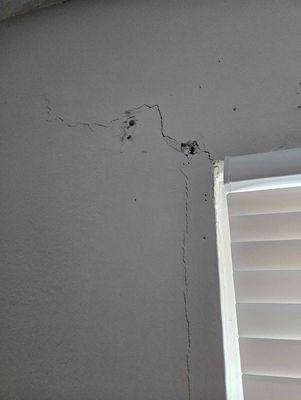 Cracks and holes on living room wall