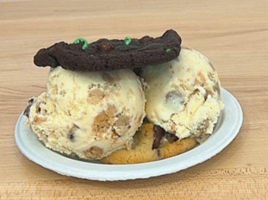 Cookie dough ice cream slammed between mint chocolate, and peanut butter chocolate cookies.