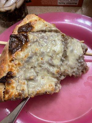 Half eaten Philly Cheesesteak Slice