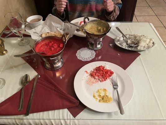 Chicken tiki masala, lamb curry, rice, Chi tea, naan bread.