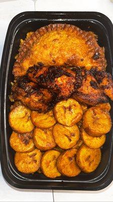 Chicken Jollof Rice plate with plantain and meat pie. So bomb!!!