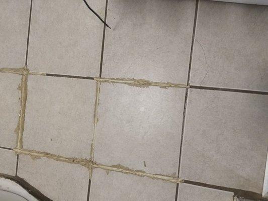 Did a 2 year old grout and tile this bathroom?