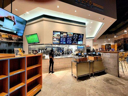 A view of the order counter from the dining area with seats for 13 people.