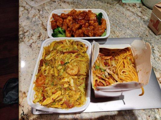 Bottom left: Singapore rice noodles Bottom right: lo mein Top: general Tso chicken