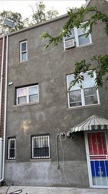 The bottom stucco was done years ago by my previous contractor. Manuel's work starts at the windows with guards all the way to the top.