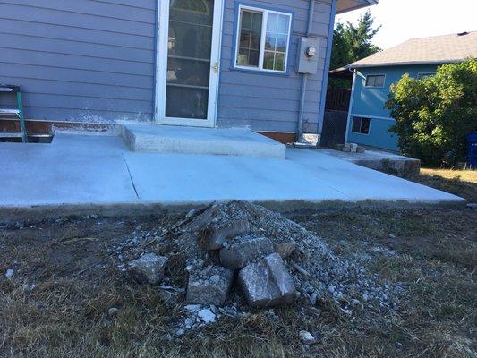 Crooked step. Large pile of debris left.