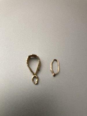 Gold cross and gold pendant broke from cheap repair.