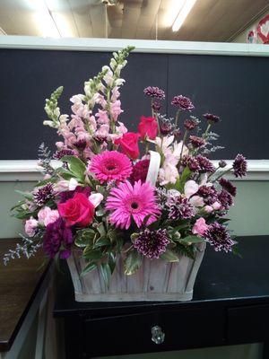 Basket of blooms in pinks and purples