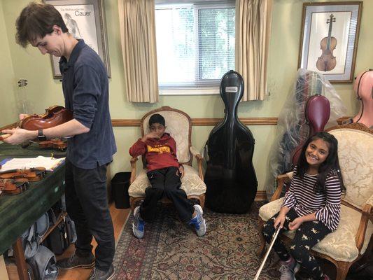 Mark, helping Usha our with a 1/4 size violin