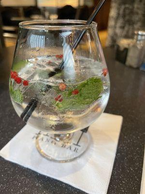 Rotating Gin and Tonic; served with red pepper corns, mint and rosemary leave. Very pretty drink