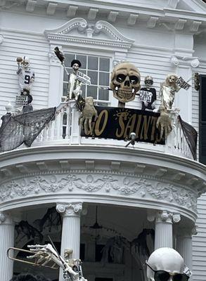 Up on the roof top, skeletons cheer for the Saints.