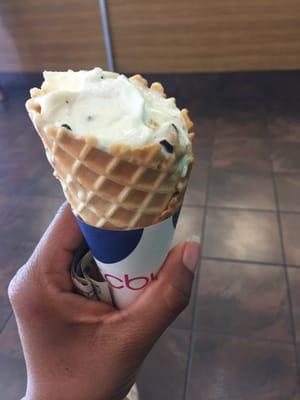 Chocolate chip cookie dough in a cone with whip